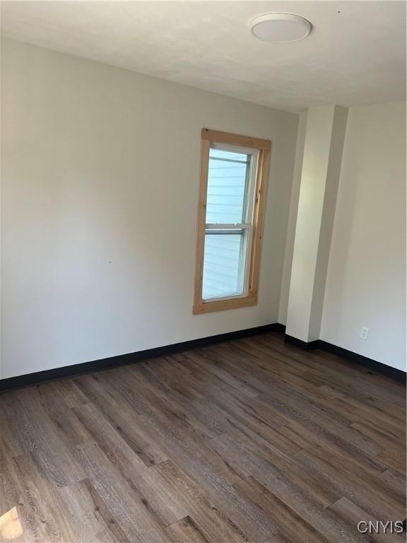 spare room featuring dark hardwood / wood-style floors