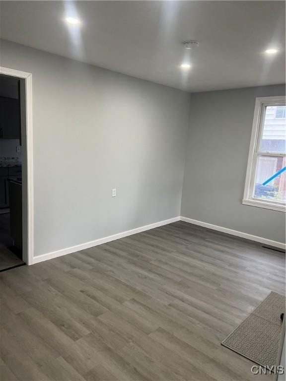 spare room with hardwood / wood-style flooring