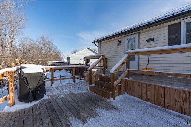 view of snow covered deck