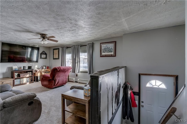 living room featuring carpet flooring, ceiling fan, a textured ceiling, and baseboard heating