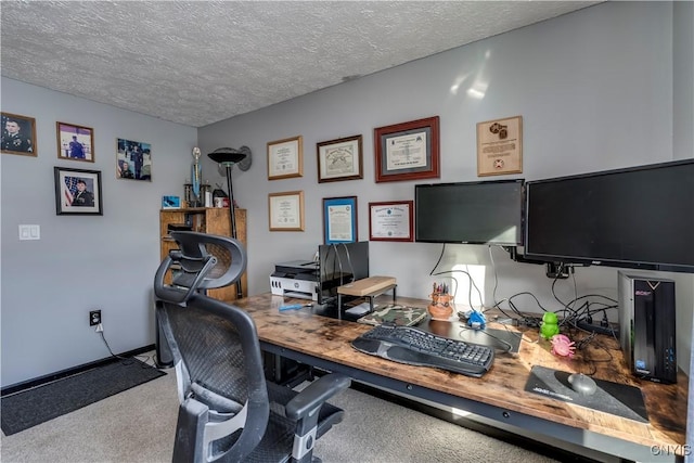 carpeted office space featuring a textured ceiling