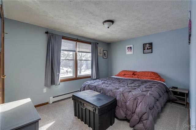 carpeted bedroom with a baseboard radiator and a textured ceiling