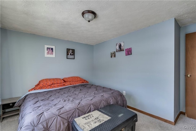 carpeted bedroom with a textured ceiling