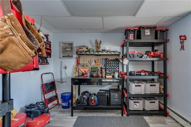 storage room featuring baseboard heating