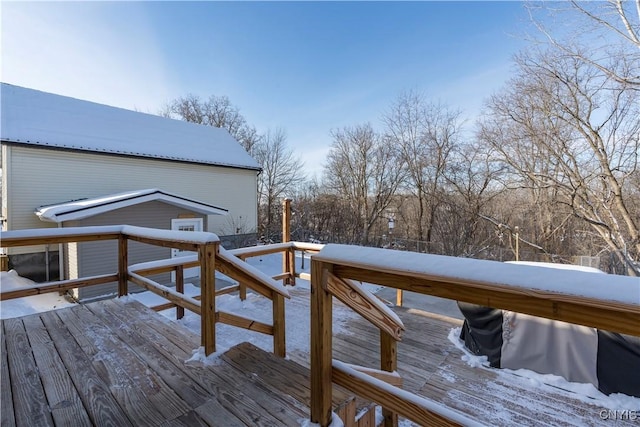 view of snow covered deck