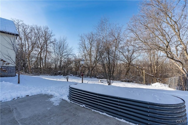 view of yard layered in snow