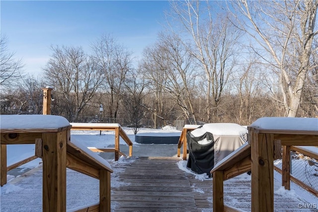 view of snow covered deck