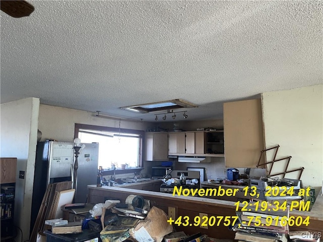 kitchen with a textured ceiling