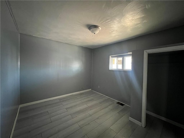 unfurnished bedroom with light wood-type flooring