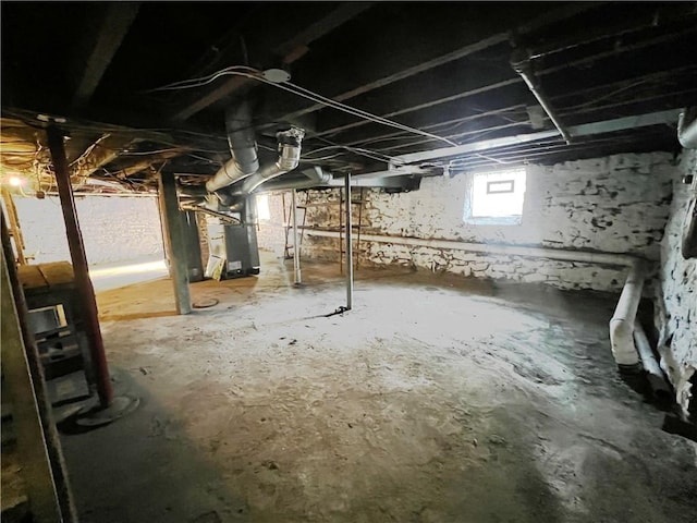 basement featuring heating unit