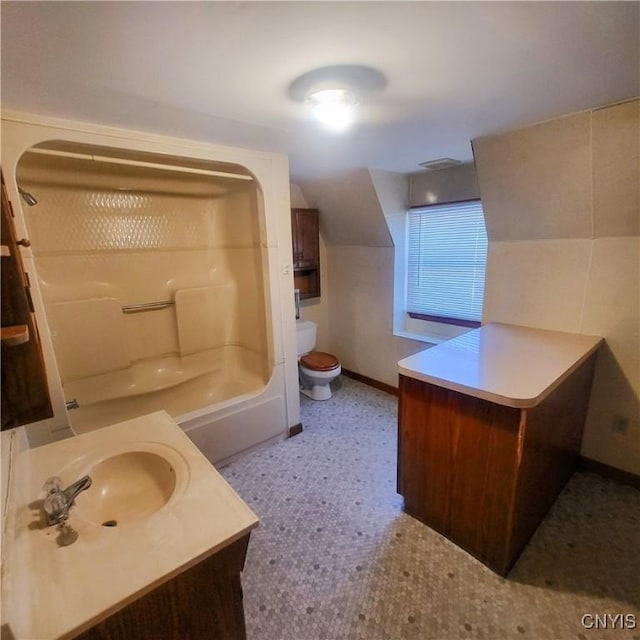 full bathroom with shower / bathing tub combination, toilet, vanity, baseboards, and tile patterned floors