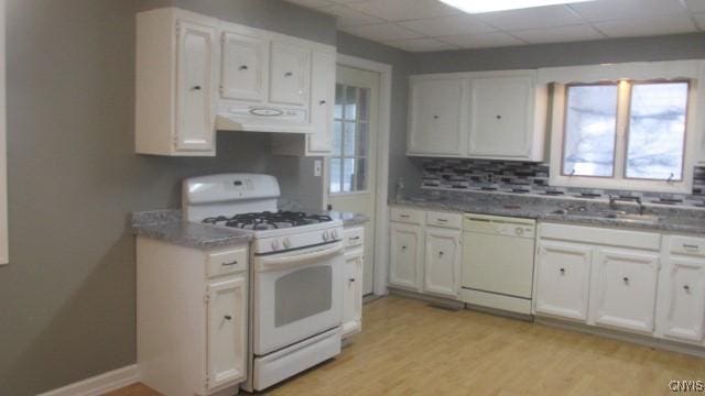 kitchen with ventilation hood, white cabinetry, light wood-type flooring, and white appliances