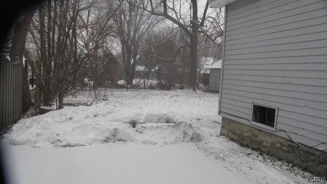 view of yard covered in snow