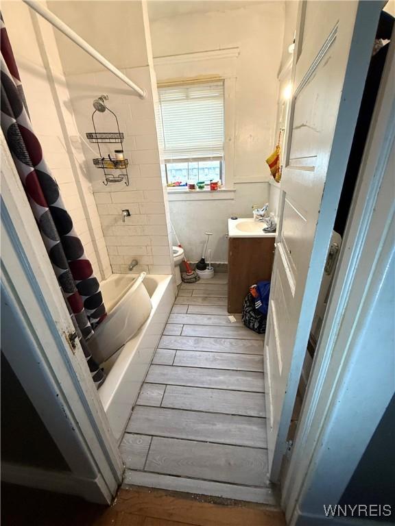 full bathroom featuring vanity, toilet, and shower / bathtub combination with curtain