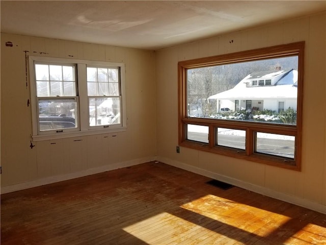 spare room featuring dark hardwood / wood-style floors