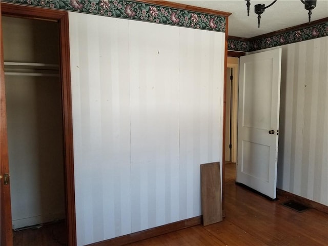 unfurnished bedroom featuring wood-type flooring