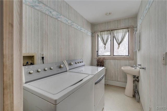 laundry room featuring washer and dryer and sink