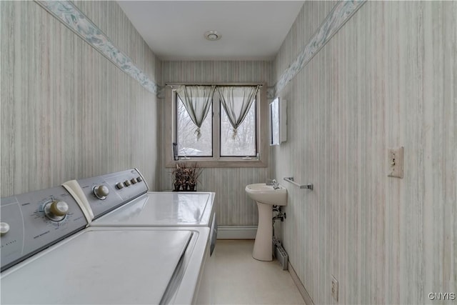 washroom featuring sink and washing machine and clothes dryer