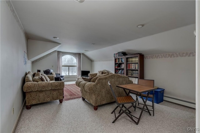 carpeted living room with vaulted ceiling and a baseboard heating unit