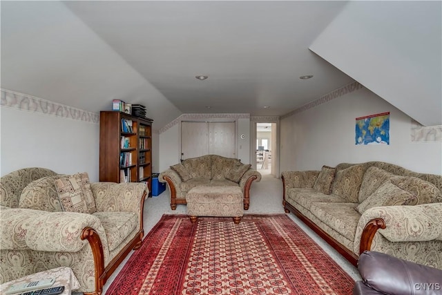 living room with carpet floors and vaulted ceiling