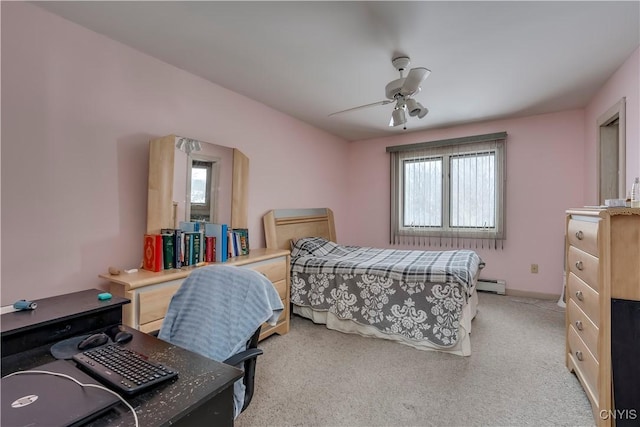 carpeted bedroom with baseboard heating and ceiling fan