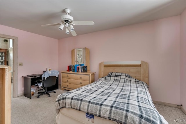 bedroom featuring light carpet and ceiling fan