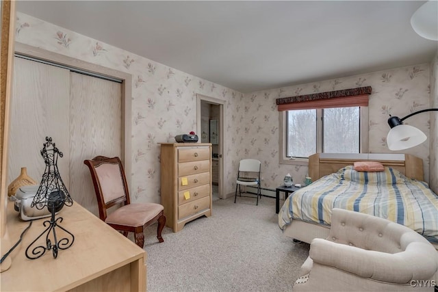 carpeted bedroom with a baseboard heating unit