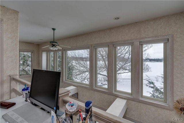 workout room with ceiling fan