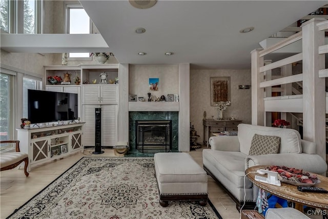 living room featuring hardwood / wood-style floors, plenty of natural light, and a fireplace