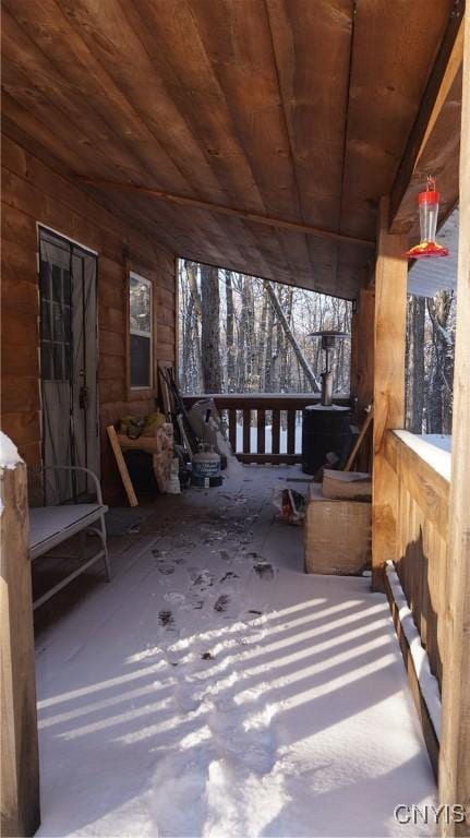 unfurnished sunroom featuring wood ceiling