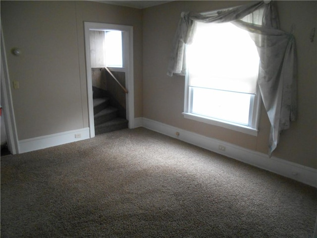 empty room with carpet flooring