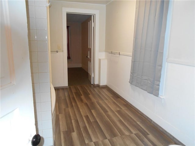 hallway with dark wood-type flooring