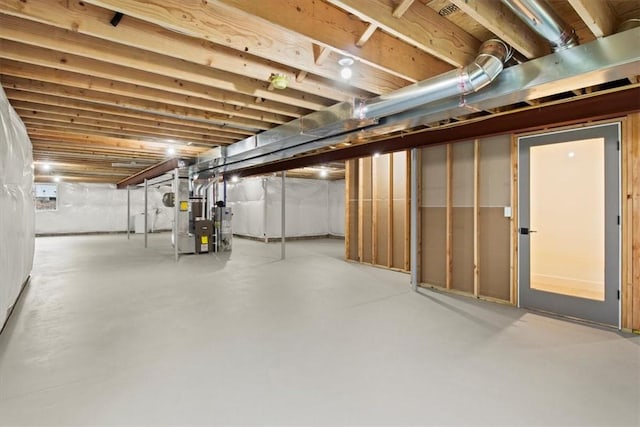 basement featuring heating unit and gas water heater