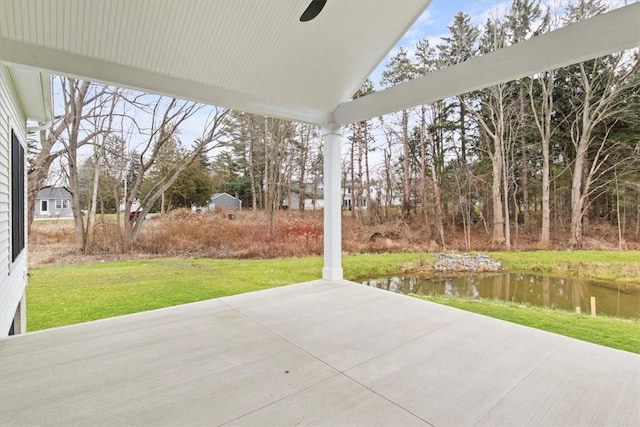 view of patio featuring a water view