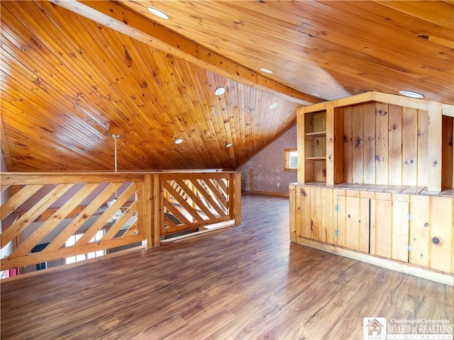 additional living space featuring hardwood / wood-style flooring, vaulted ceiling with beams, and wooden ceiling