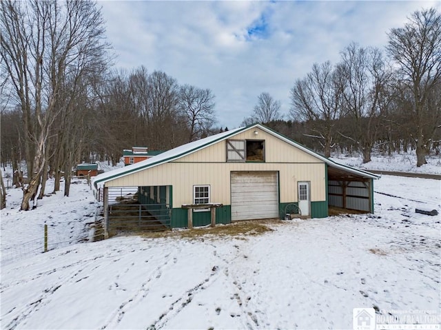 view of snow covered garage