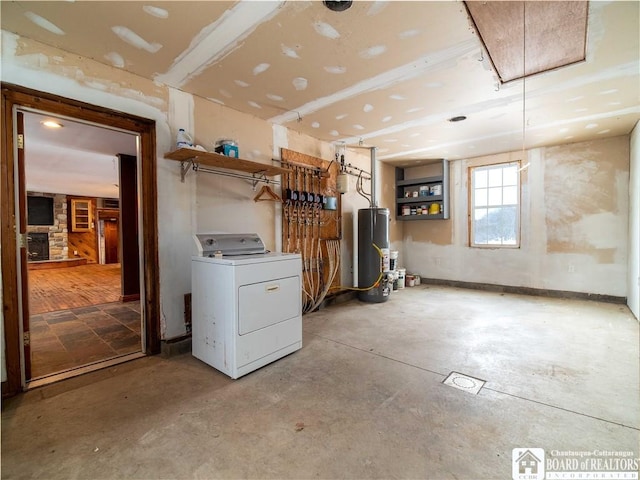 basement featuring washer / clothes dryer and water heater