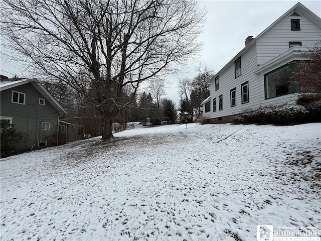 view of yard covered in snow