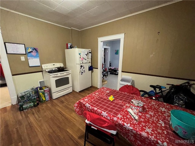 kitchen featuring hardwood / wood-style floors, white appliances, and ornamental molding