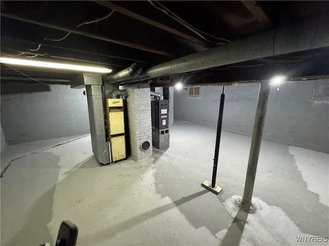 basement featuring heating unit