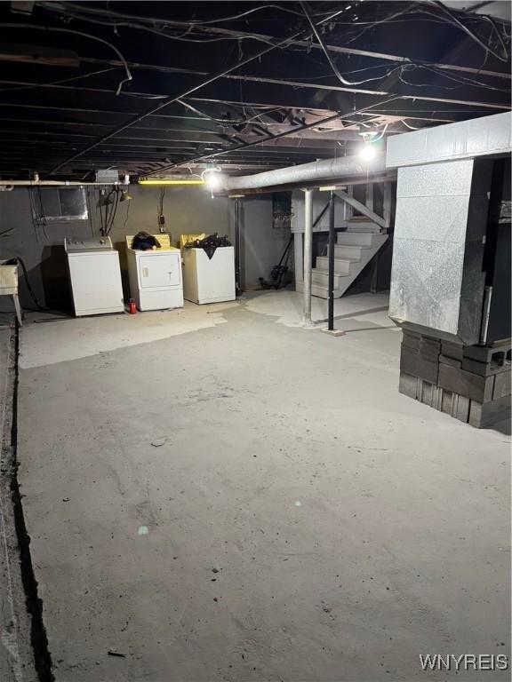 basement with washer and clothes dryer