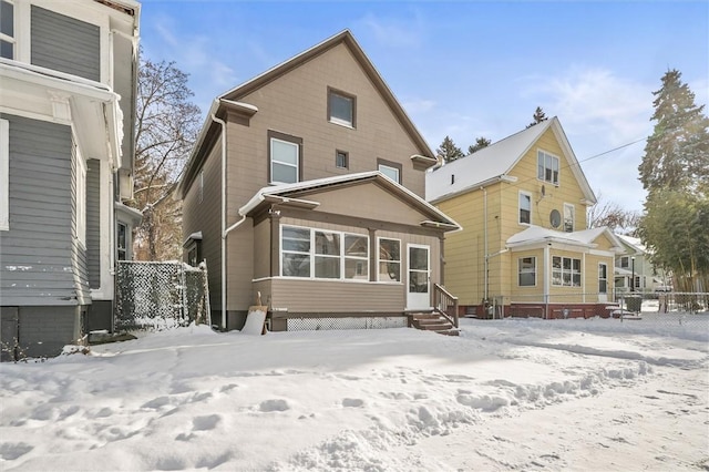 view of snow covered house