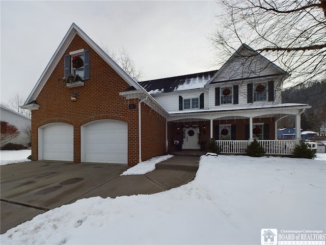 view of front of home with covered porch and a garage