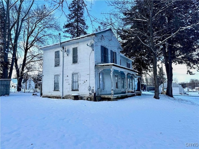 view of front of house featuring a garage and an outdoor structure