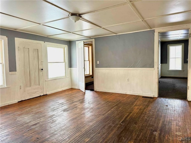 spare room with hardwood / wood-style floors