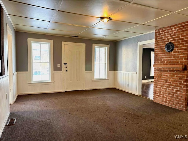 interior space featuring dark colored carpet