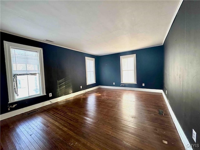 spare room with wood-type flooring