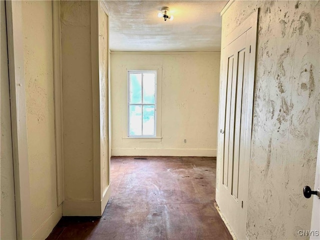 corridor featuring ornamental molding