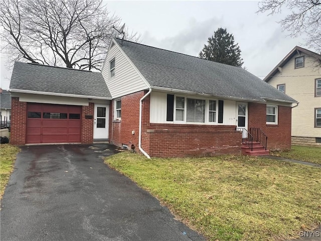 view of front of home featuring a garage and a front yard