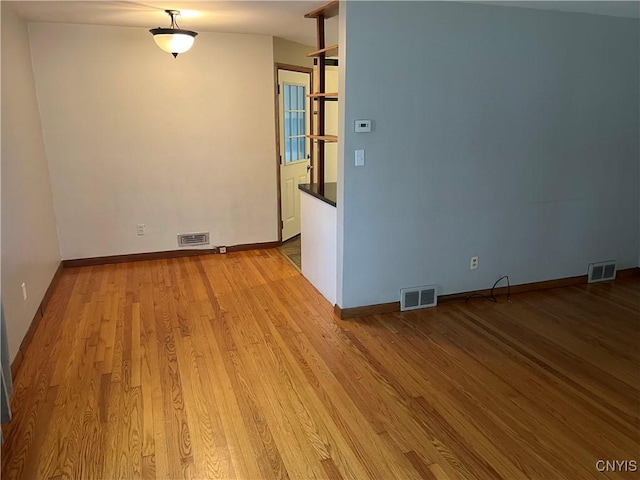 empty room with light wood-type flooring